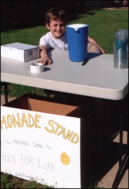 Boy with lemonade stand